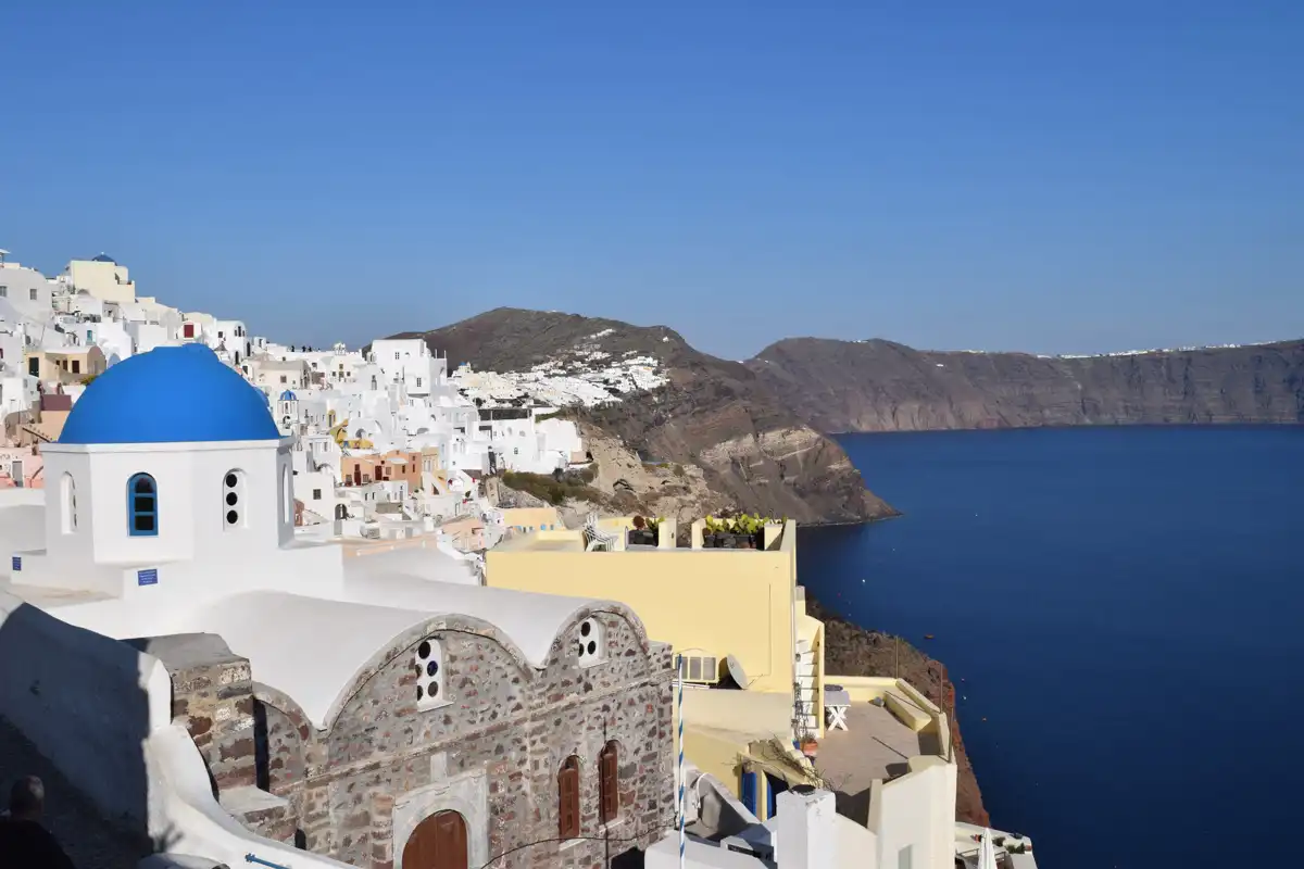 view of a traditional church in Santorini combined with an amazing sea view