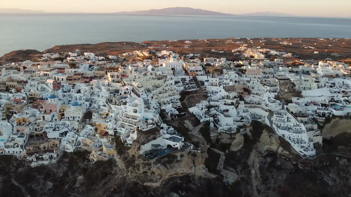 panoramic photo of a traditional Santorini village with amazing sea view