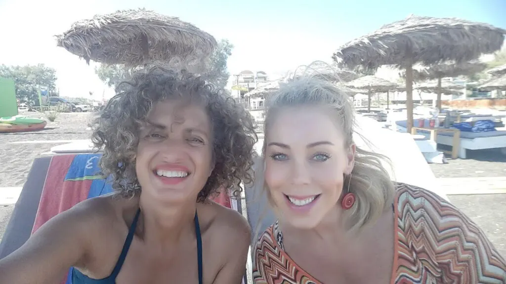 two girls on a santorini beach